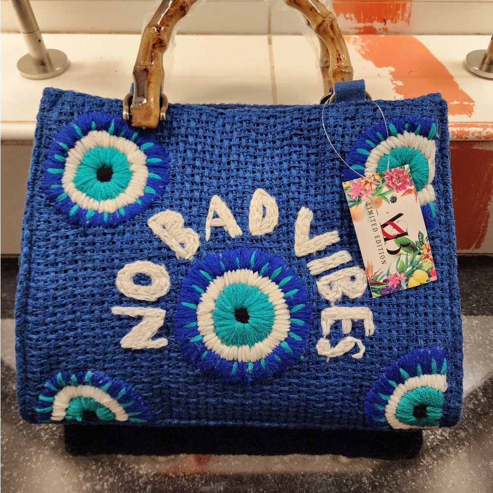 Blue and White Tote with Bamboo Handles and Vibrant Design